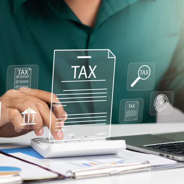 Corporate and individual tax payment concept, Businessman filing taxes on laptop financial planning and Corporate tax, Income tax return and VAT calculation government revenue and taxation concept.